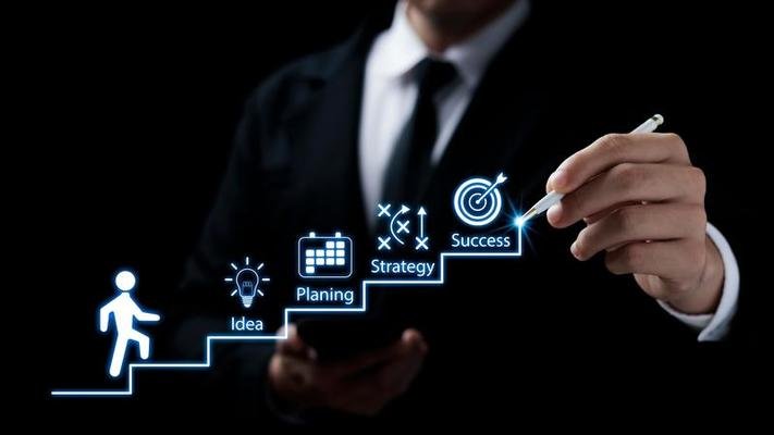 businessmen-point-to-successful-business-growth-plans-ladder-of-success-action-planning-and-long-term-business-goals-photo