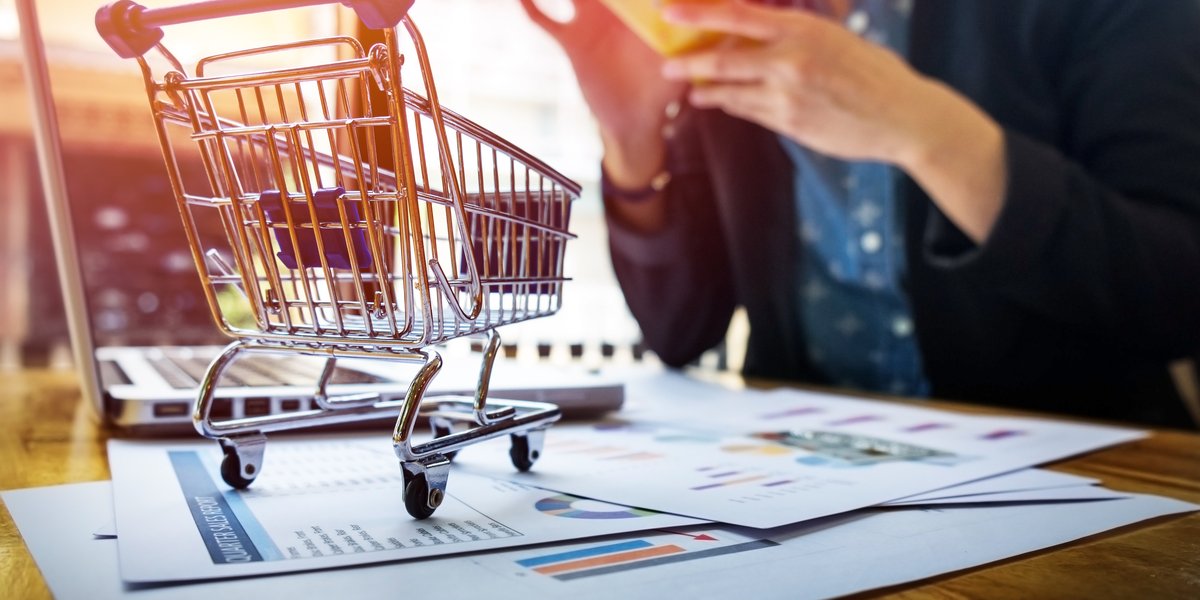 cropped-image-woman-inputting-card-information-key-phone-laptop-while-shopping-online