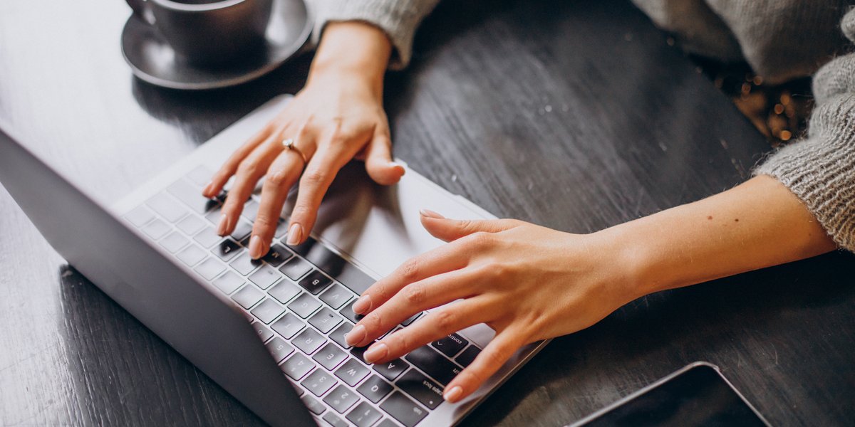 female-hands-typing-computer-keyboard