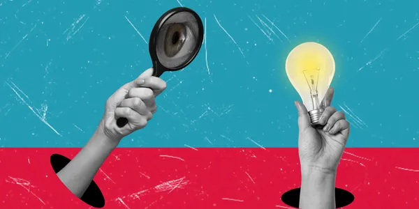 finding-unique-talented-employees-hand-with-magnifying-glass-hand-with-light-bulb