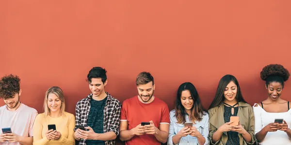 group-young-people-using-mobile-smartphone-outdoor-2021-09-22-22-39-03-utc.jpg