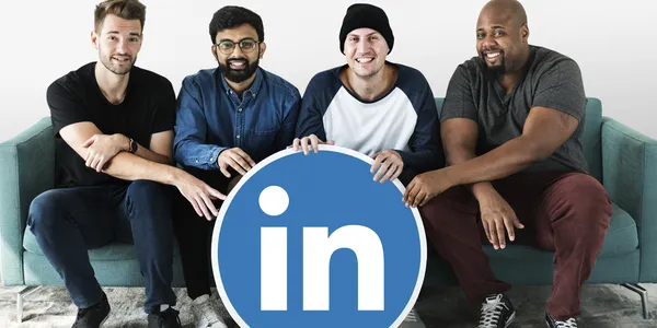 people-holding-linkedin-logo