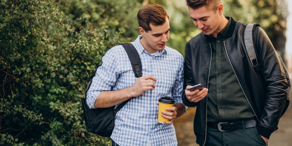 two-male-friends-students-drinking-coffee