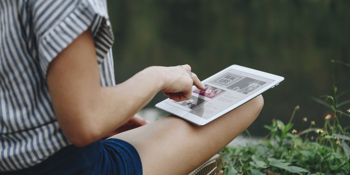 woman-alone-nature-using-digital-tablet-with-entertainment-application-screen-internet-c